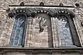The western façade with 'Freedom' by Percy Portsmouth and niche capitals Phyllis Bone