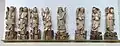 A set of figurines of the Eight Immortals, in the Sichuan University Museum. Lan Caihe is second from the left, holding up a basket of flowers. nd.
