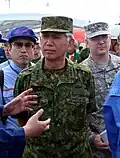 Former Chief of Staff of the Japan Ground Self-Defense Force Eiji Kimizuka. Cloth rank-surname tape in Japanese on left chest, cloth surname tape on right chest in English.
