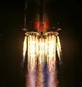 Closeup of booster and core stage engines of a Soyuz‑2.1a during launch