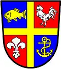 a fillet cross (or cross fillet)—Quarterly, azure and gules; 1. a fish naiant or; 2. a cock argent; 3. a fleur de lis argent; 4, an anchor fouled or; over all a fillet cross or—Port Alfred Municipality, RSA
