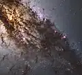"Hubble's panchromatic vision... reveals the vibrant glow of young, blue star clusters..."[57]