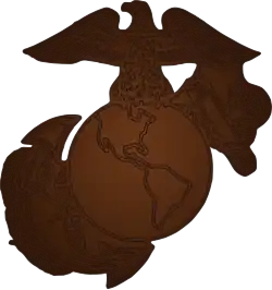 Bronze eagle atop globe covering anchor