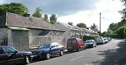 Former village school and estate cottages.