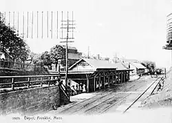 A wooden railway station and freight house