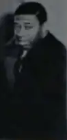 A singer wearing a suit