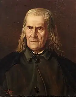 Man sitting and looking to the left