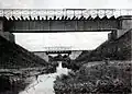 A black-and-white photograph of bridges over the Niemica River.