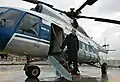 Vladimir Putin exits his helicopter on the roof of the GRU headquarters