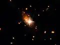 Arc-shaped tidal tails in galaxy 3C186.[15]