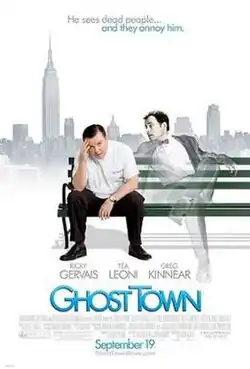A man sitting on a bench, sitting beside is another man who is almost transparent