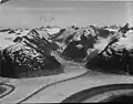 Glacier King to right and The Tusk at upper right edge of frame. Gilkey Glacier in lower part of frame.