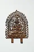 Unified Silla dynasty. Of the ten Buddha plates excavated from Wolji, Gyeongju. Two spikes of different lengths extend from the bottom of the pedestal, indicating that the plate was once fixed onto something.