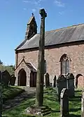 View of the cross and church, from the SE