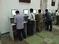 Visitors searching for books at a computer catalogue at the Grand People's Study House