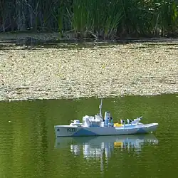 Model of HMCS&nbsp;Sackville in Griffin Pond