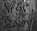 Circa 1200 A.D. Gunnar playing the lyre with his toes, lyre sitting with the top up. Austad stavkirkeportal (Austad Stave Church portal).