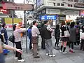 Commuters queueing at Pitt Street bus stop