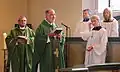 Female servers with bishop and pastor
