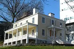 View of Hamilton Grange, a two-story clapboard house, from 141st Street