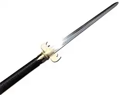Closeup of a modern recreation of the sha with a bat shaped guard