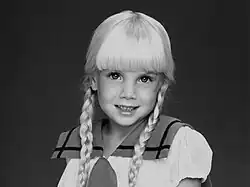 Young female child with blonde hair posed