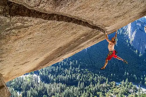German climber Hans Zak on a granite roof climb in Yosemite