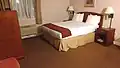 A queen sized bed with a straight valance, Los Altos, California