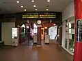 Ticket gate and steps leading down to the platforms.