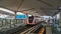 The Hyundai Rotem LRT train arriving at the station platform