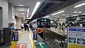 The staffed QR code ticket readers at the southern end of platform 5 at Ikebukuro Station in September 2014