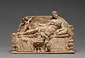 A woman, almost certainly Venus, reclines on a couch accompanied by two cupid attendants (reproduction)
