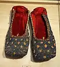 Indian Mojari, 19th century, red velvet with gold embroidery and sequins