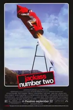 In a black background, a skull with two crunches crossing each other, bearing resemblance of a poison pictogram. Below it, the films titles with the word "Jackass" missing in the poster followed by a warning regarding to stunts performed in the film.