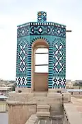 Turret-style canopy on the roofline