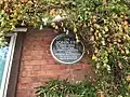 Plaque to John Fry on St James's Practice