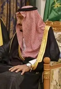 Image 16Red and white keffiyeh commonly worn in the desert held with a black agal (from Culture of Saudi Arabia)