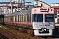 Salmon pink liveried set 1710 in December 2022