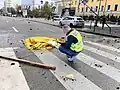A dead civilian under a blanket after a missile attack on Kyiv city centre on 10 October 2022