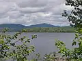 Lac Aux Araignées, public access point route 161. Mount Flat Top (830 meters) on the left;[5] and Merrill (997 meters) in the center, background.