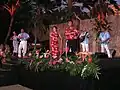Dancers and musicians at a lūʻau for tourists