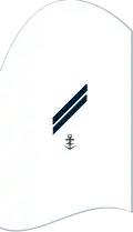 c. Cuff title to the dark white seaman shirt (here: Obergefreiter with a control & communications rating)