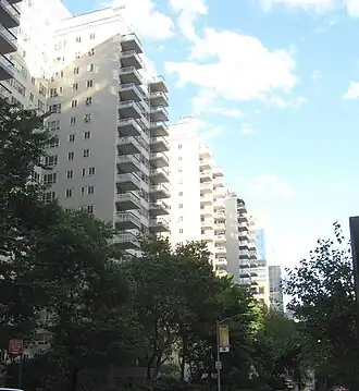 Looking east from Third Avenue along East 65th Street at Manhattan House, on a sunny afternoon.