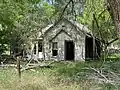 Dilapidated former home in May, in April 2024