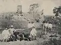 Bendegó meteorite in a photograph by H. Antunes, taken in 1887, showing the meteorite still on the bank of the Bendegó stream, with vice admiral José Carlos de Carvalho and engineers Humberto Saraiva Antunes and Vicente José de Carvalho.