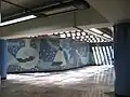 Picture of the mural below a ventilation sewer system.