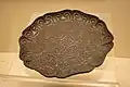 A Ming Dynasty (1368–1644) black lacquerware plate