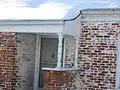 7th Avenue: example of a spindle porch column and the use of chair backs for decoration.