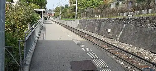 Platform shelter on a platform next to railway line
