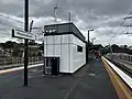 The station's PSO building, emergency exit fencing and eastern end shelter, October 2024